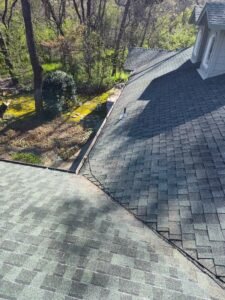 After picture of Roof valley filled with leaves