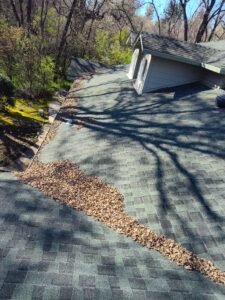 Roof valley filled with leaves
